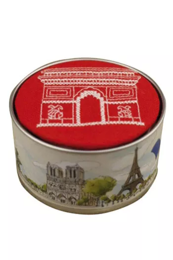 Sajou round box embroidered in cross stitch with an ecru Arc de Triomphe motif on a red base Sajou round box embroidered in cross stitch with an ecru Arc de Triomphe motif on a red base