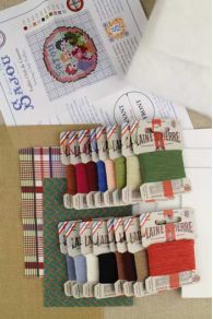 Detailed contents of the Sajou Sewing Club needlepoint kit to make stuffed puffies