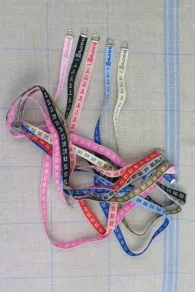 Collection of Sajou woven dressmaker’s tape measures in various colours