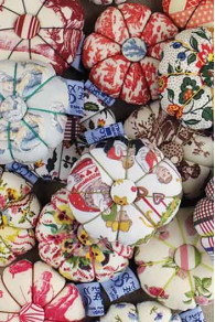 Collection of Sajou pumpkin shaped pin cushions