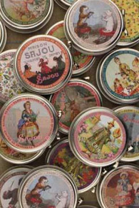 Sajou haberdashery products in round metal tins