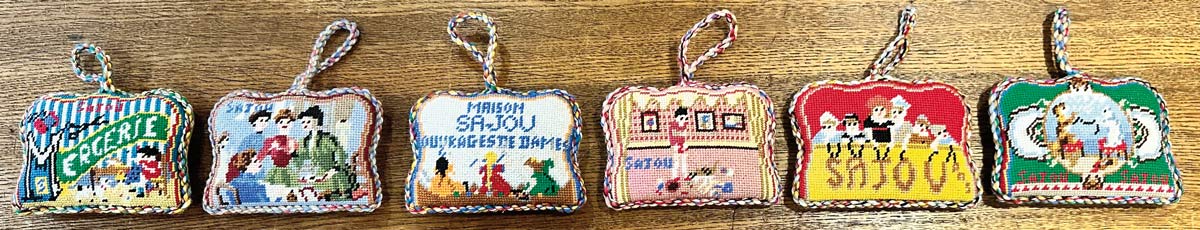 The Sajou needlepoint puffies inspired by our iconic needlebook covers